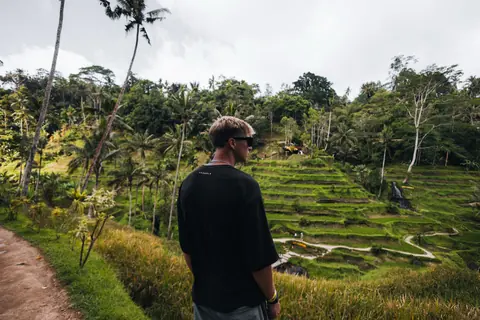 Malakai looking over green rice terraces